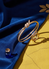 Bracelet and ring set with knot and crystals – gold / silver