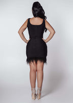 Rochie Bling Charm scurta neagra, lycra cu cristale si pene, vedere spate pe model, rochie mini bodycon eleganta