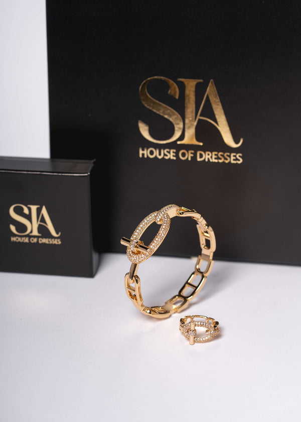 Set SIA Urban Icon – brățară și inel cu cristale aurii pe fundal negru, bijuterii statement elegante